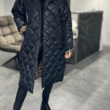 Kynzi – Elegant Vadderad Kappa