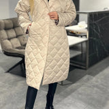 Kynzi – Elegant Vadderad Kappa