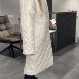 Kynzi – Elegant Vadderad Kappa
